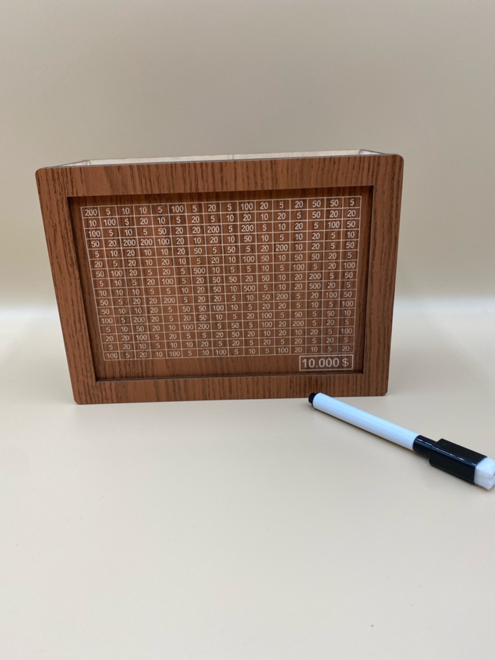 Wood Grain piggy bank Frame with White Grid cross off amounts to get to $10,000
